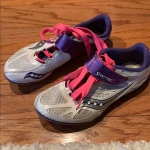 Sprinting spikes, pink, white and purple, track